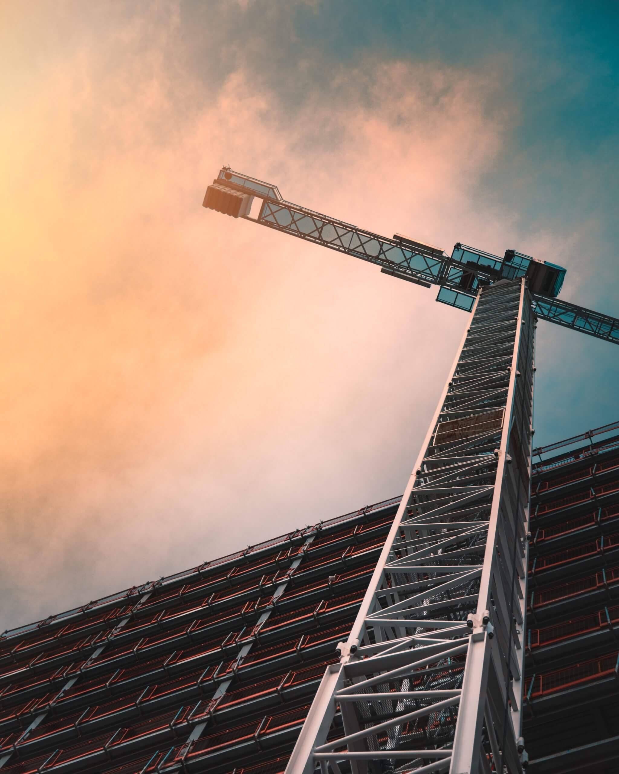 A creatively captured image of a crane, symbolizing the construction industry, relevant to the specialized field of construction litigation attorneys.